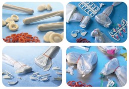 Чотири секції з різними компонентами для біопсії: голки для біопсії різних розмірів, одноразові пакети для датчиків УЗД, захисні чохли та інші аксесуари.