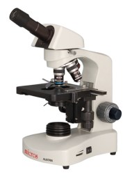 Мікроскоп Micros білого кольору з монокулярною насадкою, револьверним механізмом та механічним предметним столиком. 